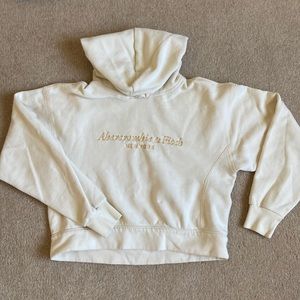 Light yellow cropped sweatshirt.